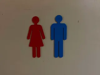 Toilet markings, stick figures on the toilet door
