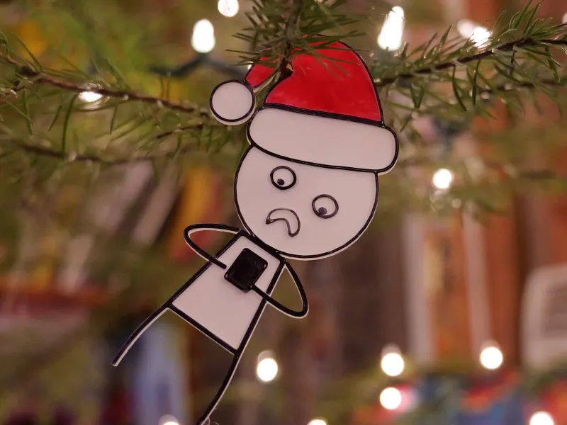 Christmas ornament stick man on phone
