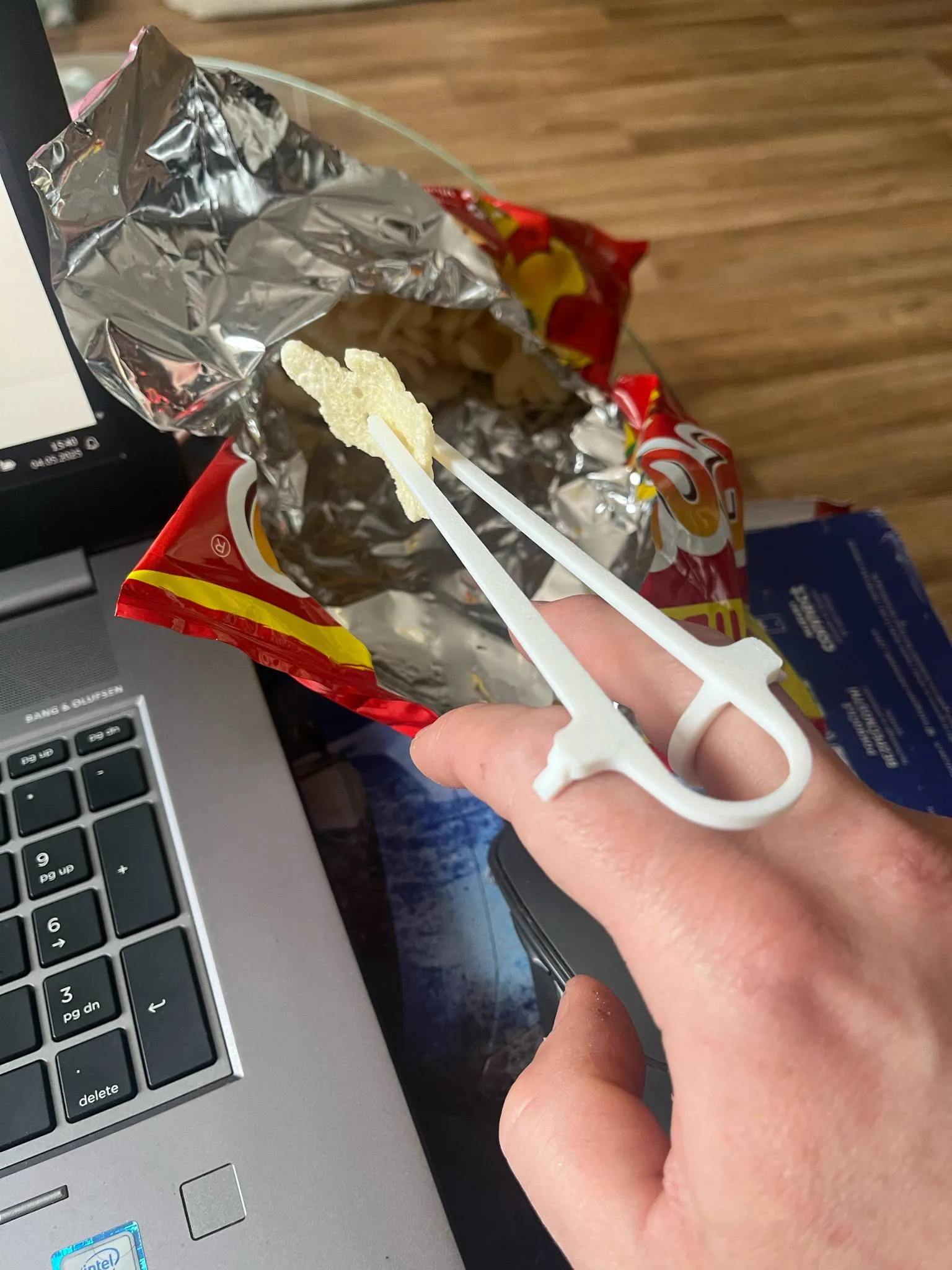 A device for eating chips, nachos, chopsticks for eating