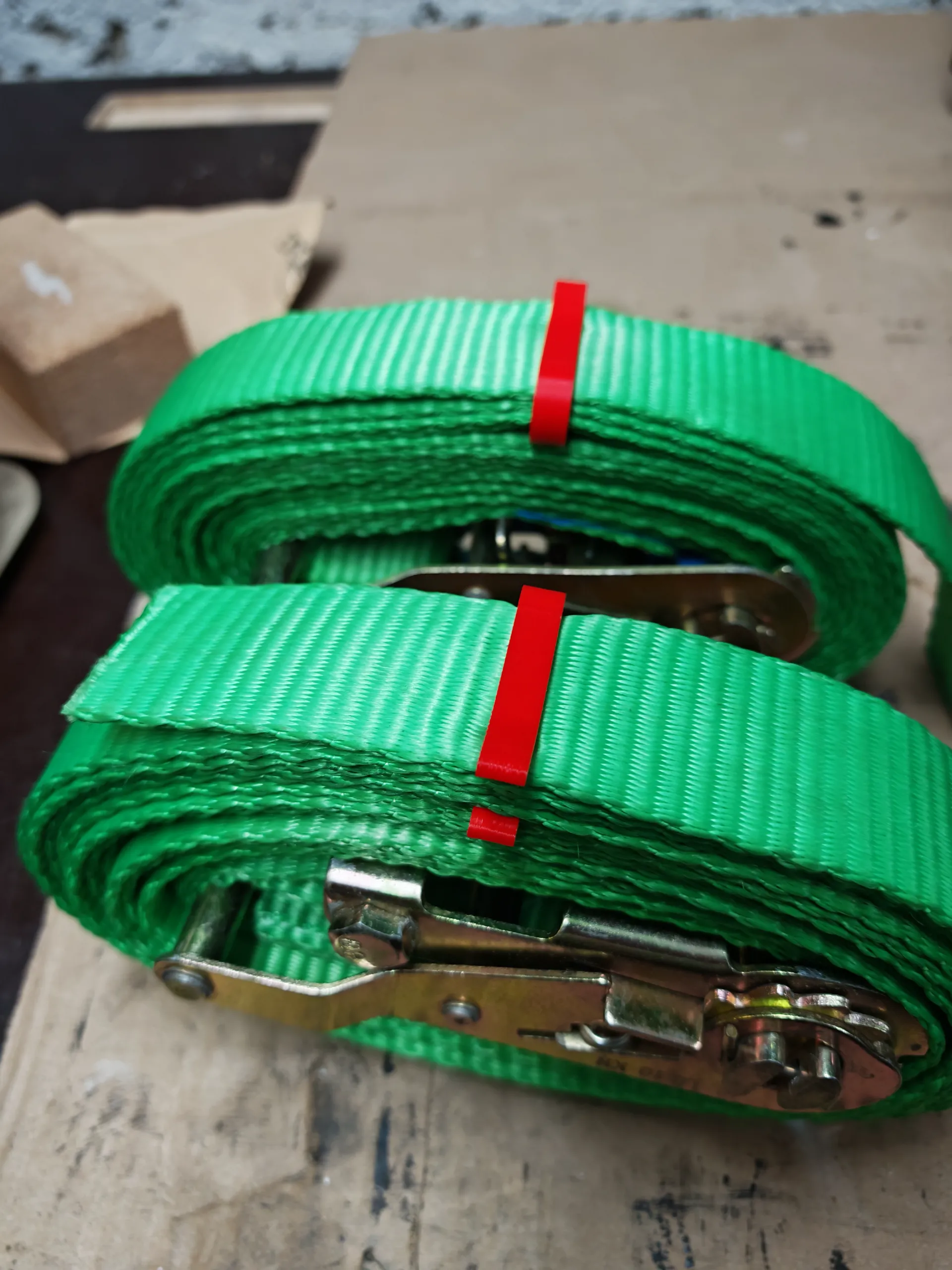 Securing clips for ratchet straps-0