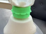 Holds bottles upside down to get the last part of the liquid-2