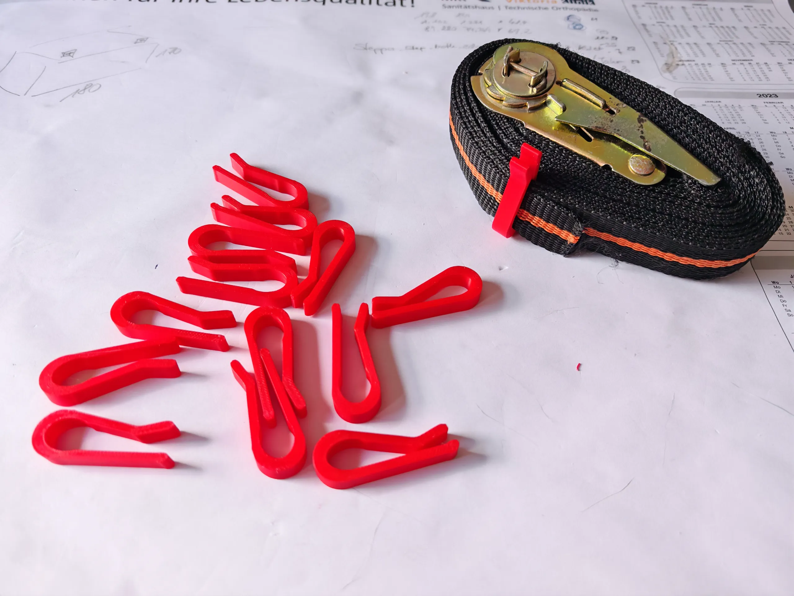 Securing clips for ratchet straps-1