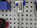 Caliper holder for perforated plate-1