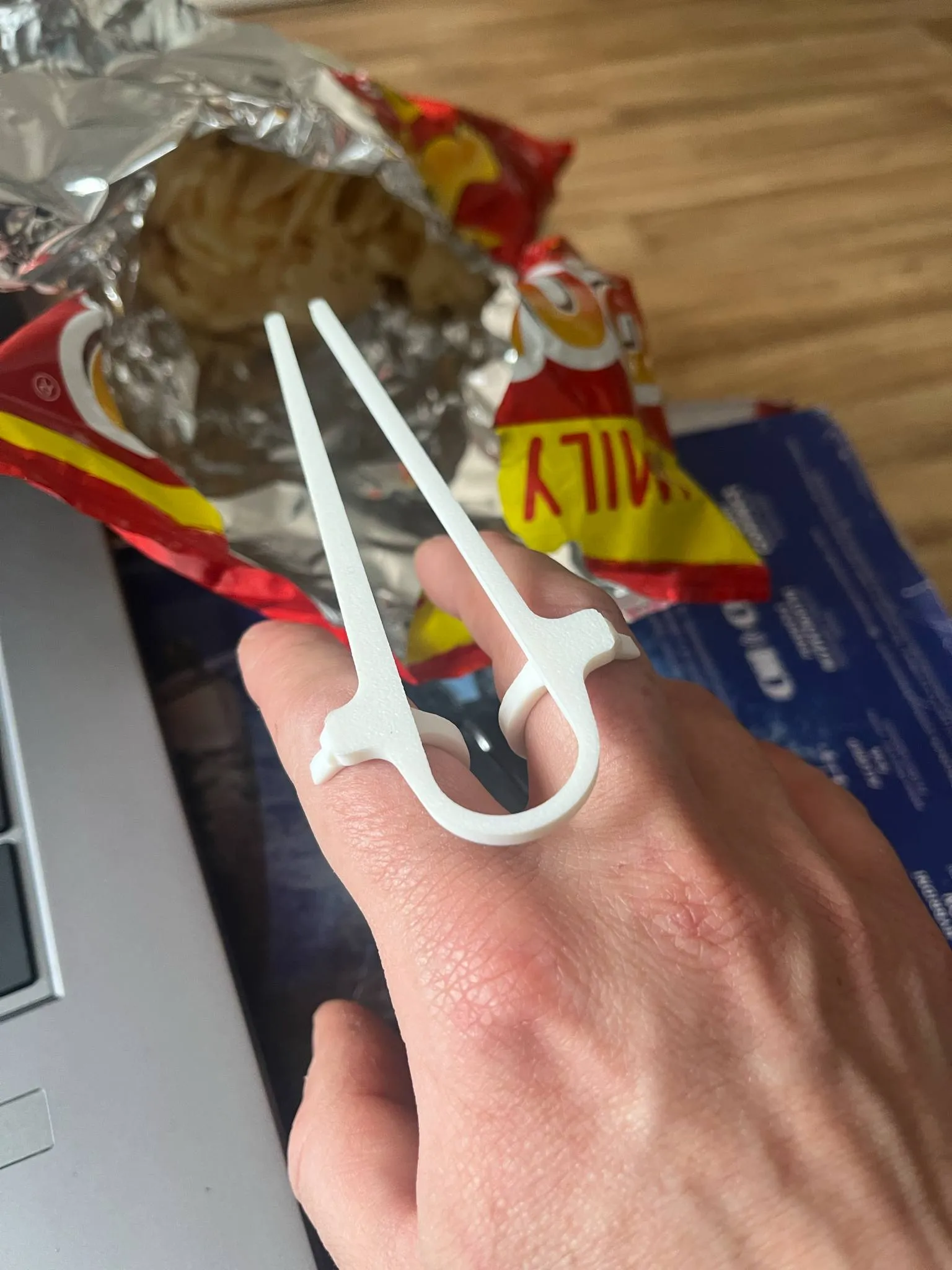 A device for eating chips, nachos, chopsticks for eating
