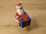 Santa Holding a Present-0