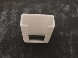 Wall mounted soundbar remote control holder.