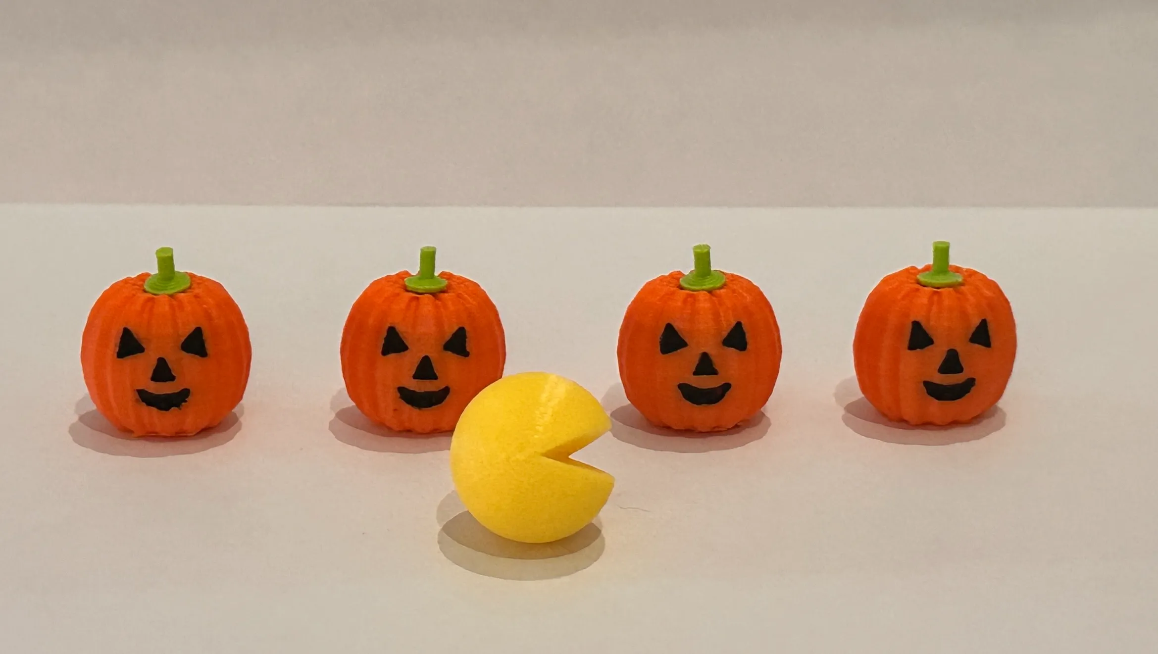 Pac Man fridge magnet with Halloween attachments.