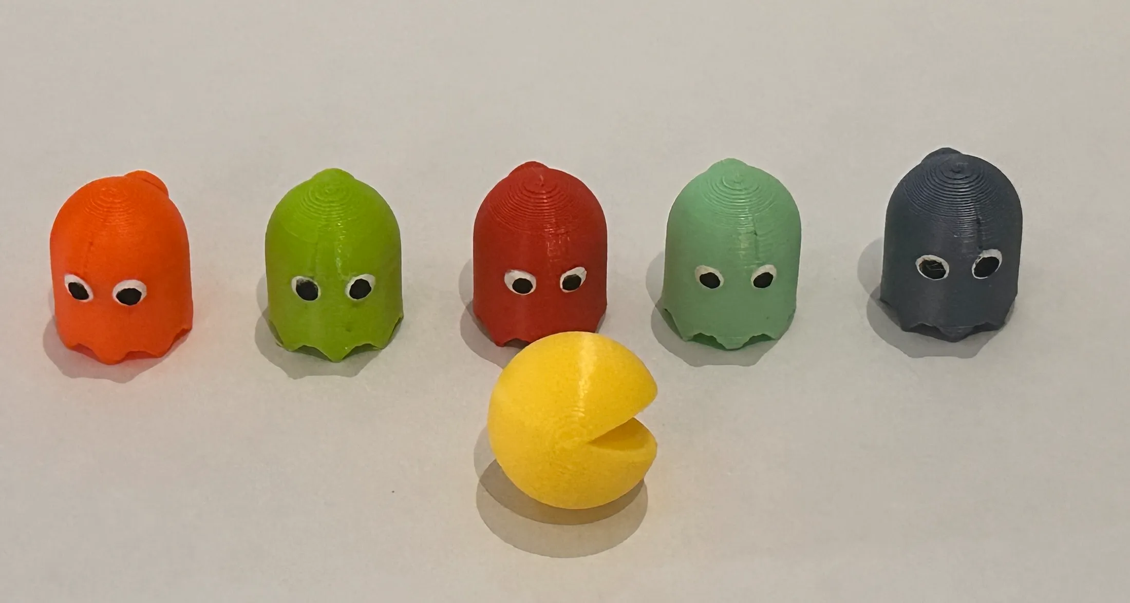 Pac Man fridge magnet with Halloween attachments.