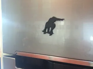 Skateboarding fridge magnet
