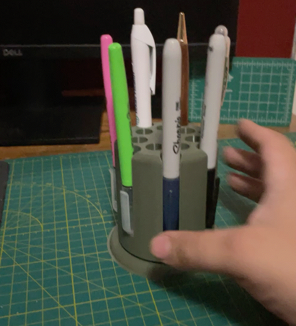 Rotating pen, pencil, and sharpie holder