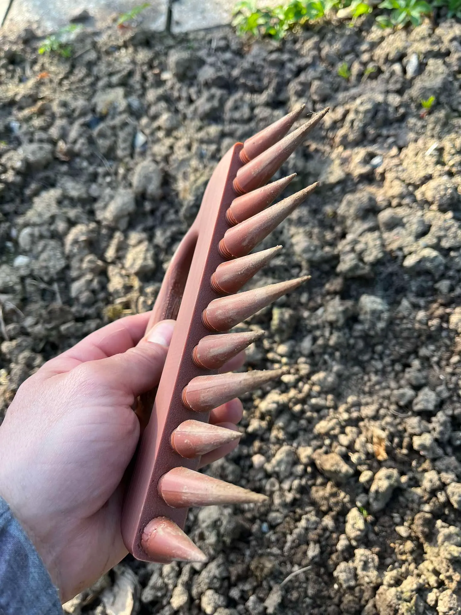 Rake in hand, stake