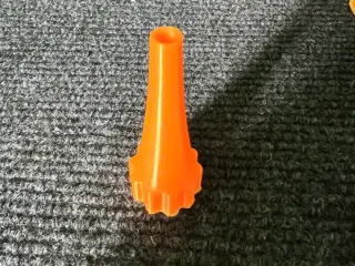 Seal gun nozzles and cork