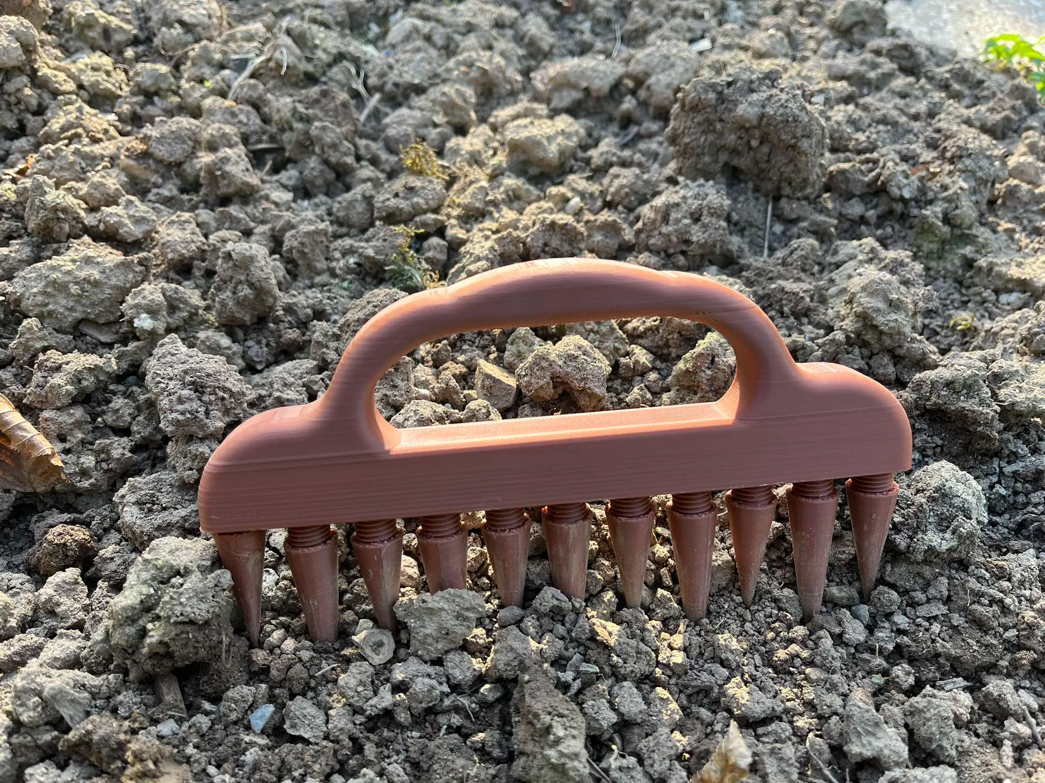 Rake in hand, stake