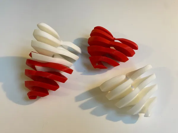 Intertwined Hearts: Fidget, Decoration, and Gift