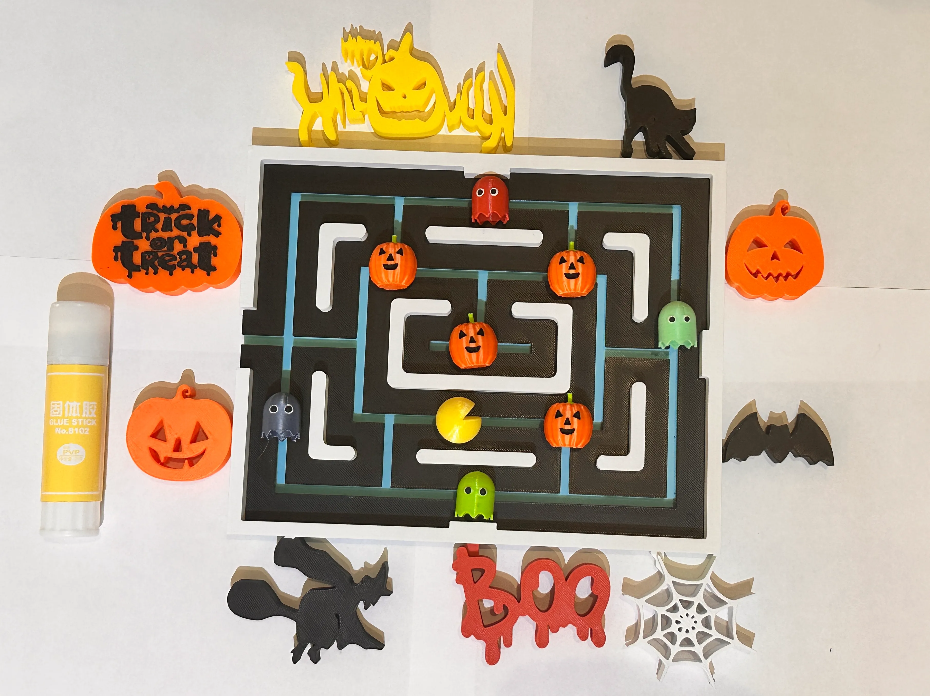 Pac Man fridge magnet with Halloween attachments.