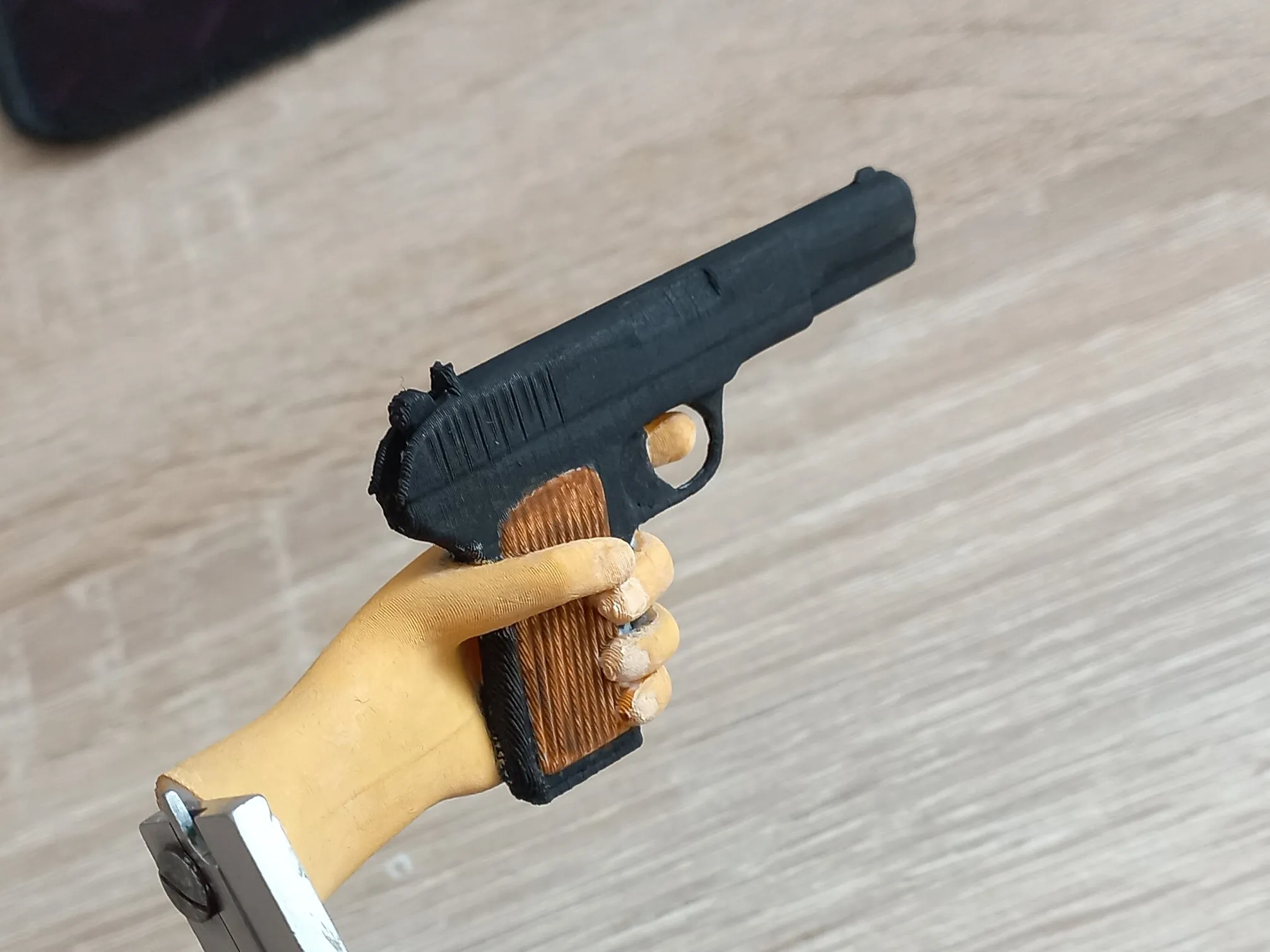 Hand with gun magnet