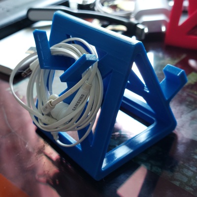 Phone stand with headphone hanger