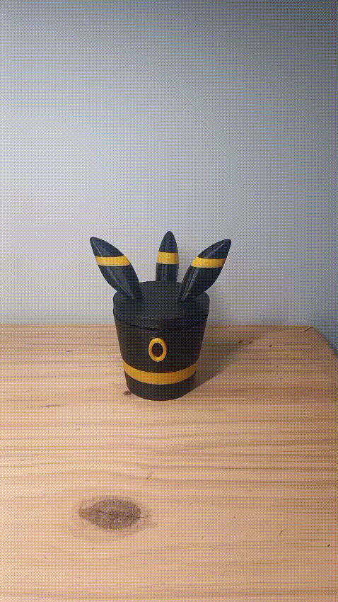 CAJA POKEMON (UMBREON)