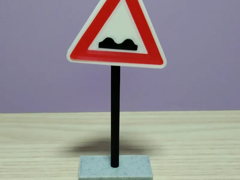 Road sign - unevenness on the road