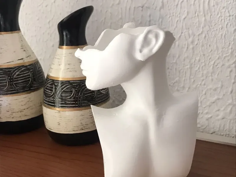 sculpture of a woman - vase