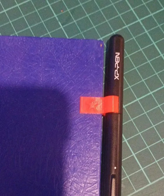 Notebook pen holder