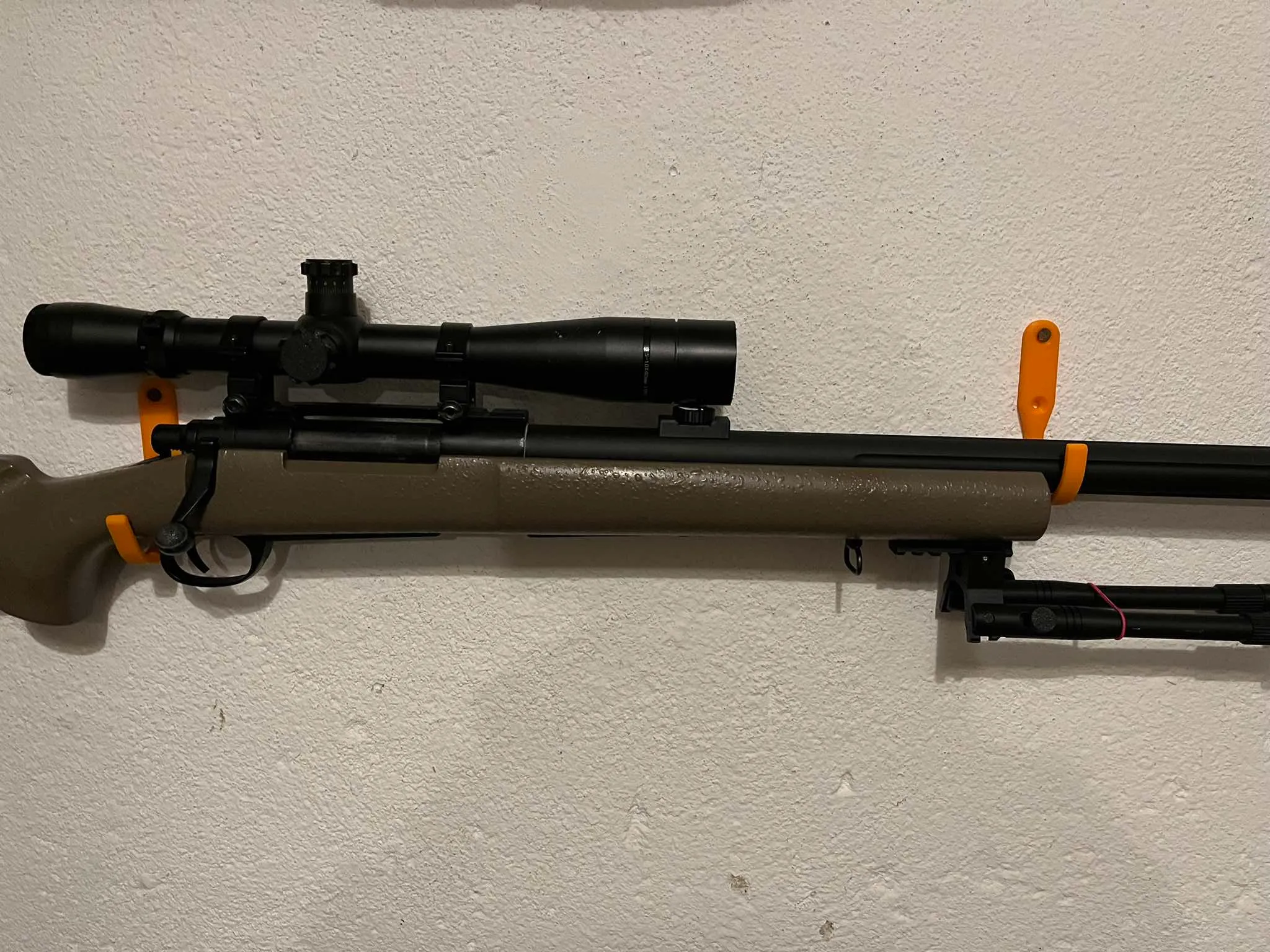 Airsoft gun mounts on the wall