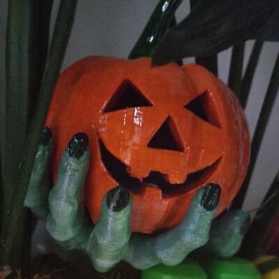 A pumpkin in a Zombie hand 3d model