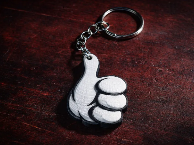 Keychain dedo_arriba_1