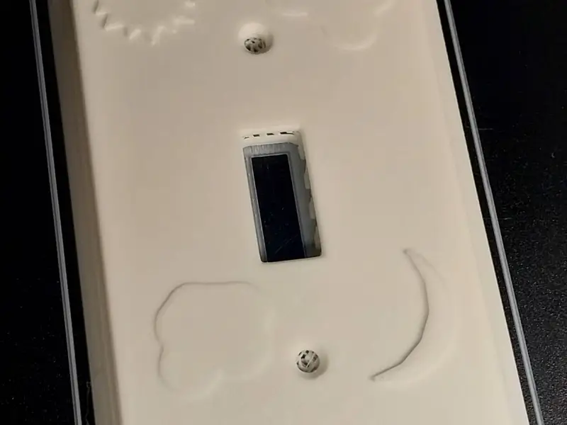 Light switch plate with sun and moon