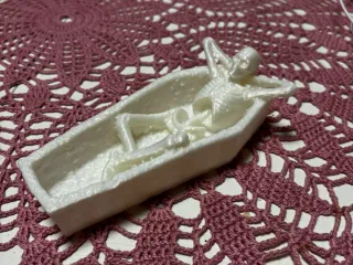 Skeleton in a coffin