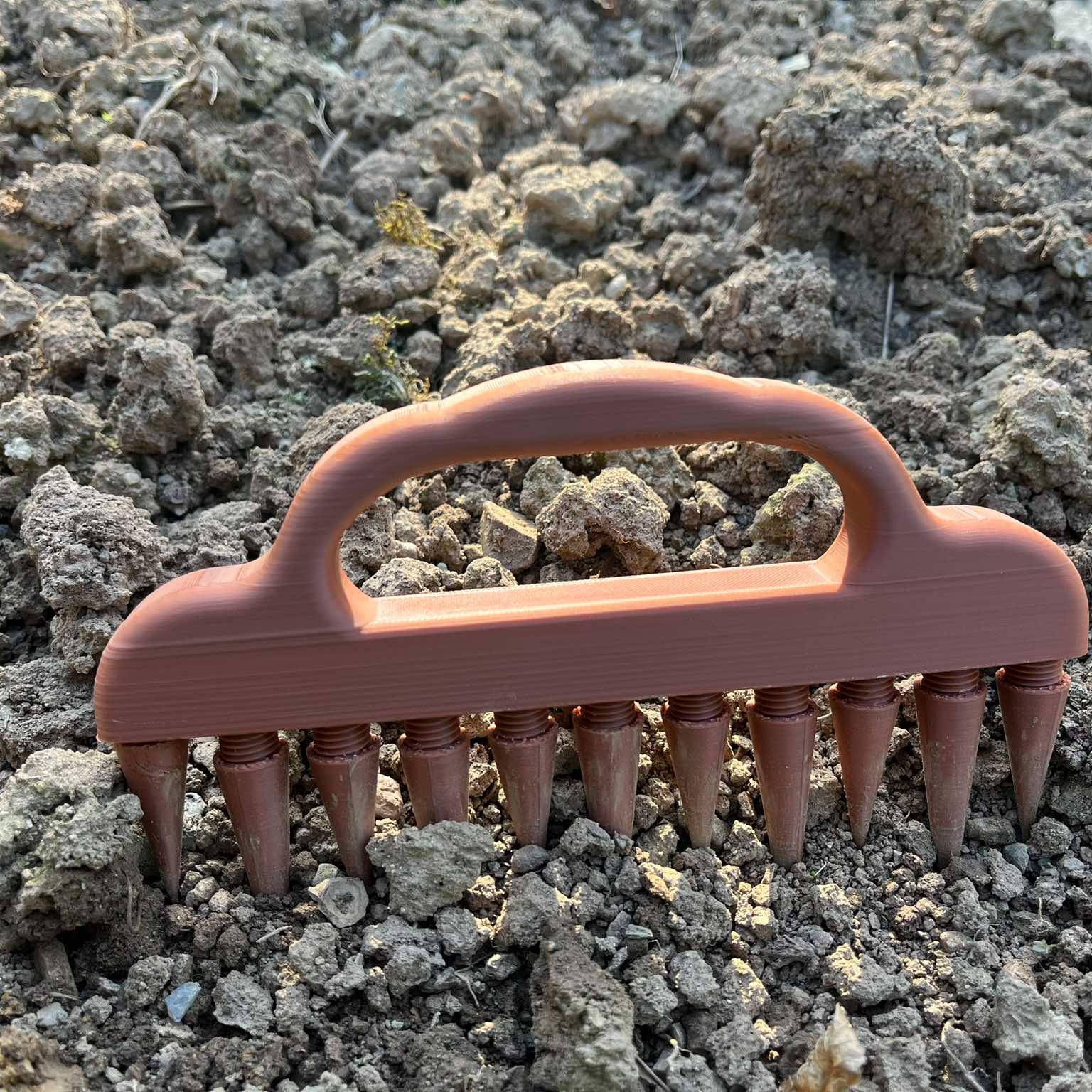 Rake in hand, stake