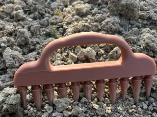 Rake in hand, stake