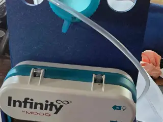 MOOG Infinity Holder and Stand for feeding bag, and device
