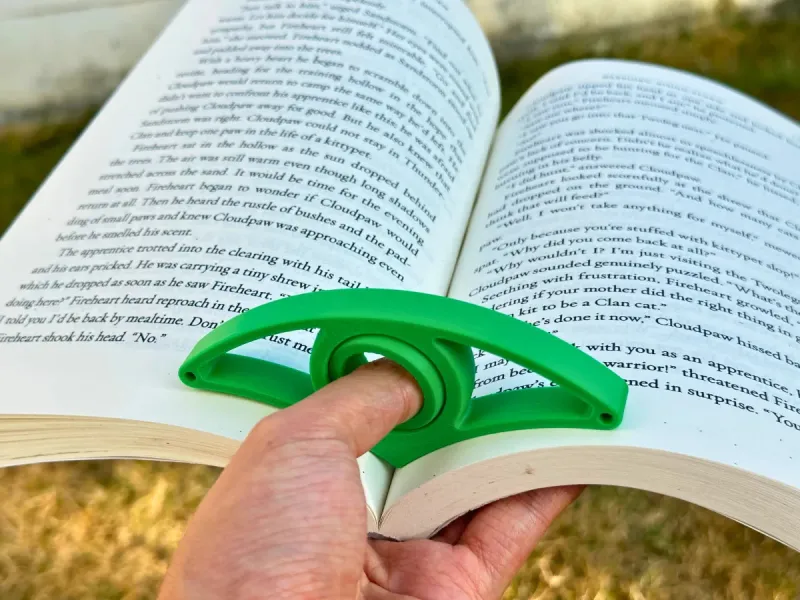Suporte de Páginas de Livro V2 – Apoio de Polegar Rotativo 360°
