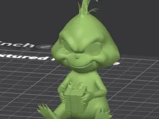 Baby Grinch sitting holding present, no CFS, eyes seperate