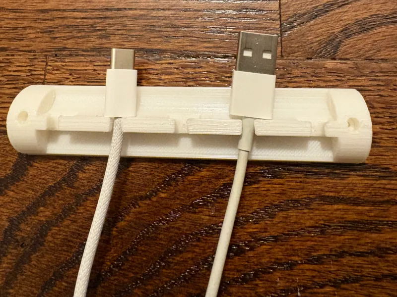 Wall-mountable cable holder