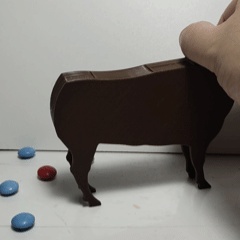 Pooping bull candy dispenser