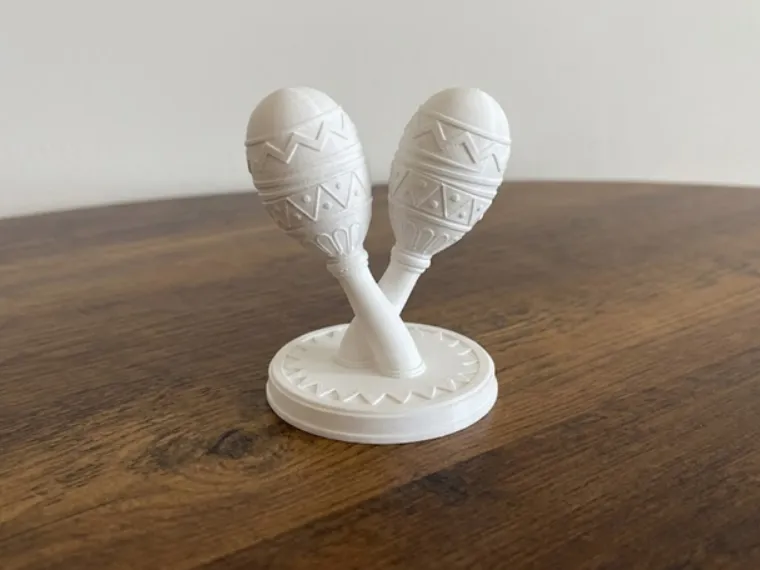 Maracas încrucișate pe o bază de expunere - Decorațiune