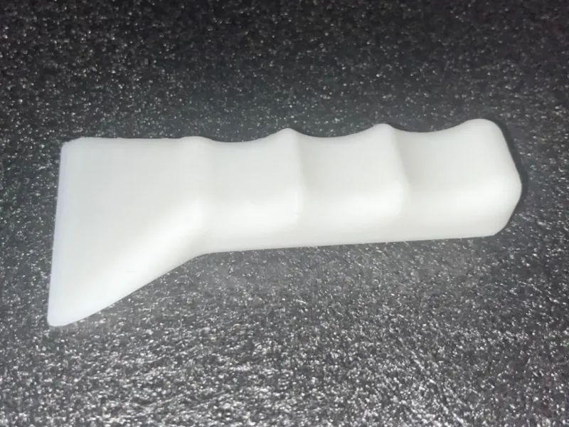 Ergonomic bed scraper