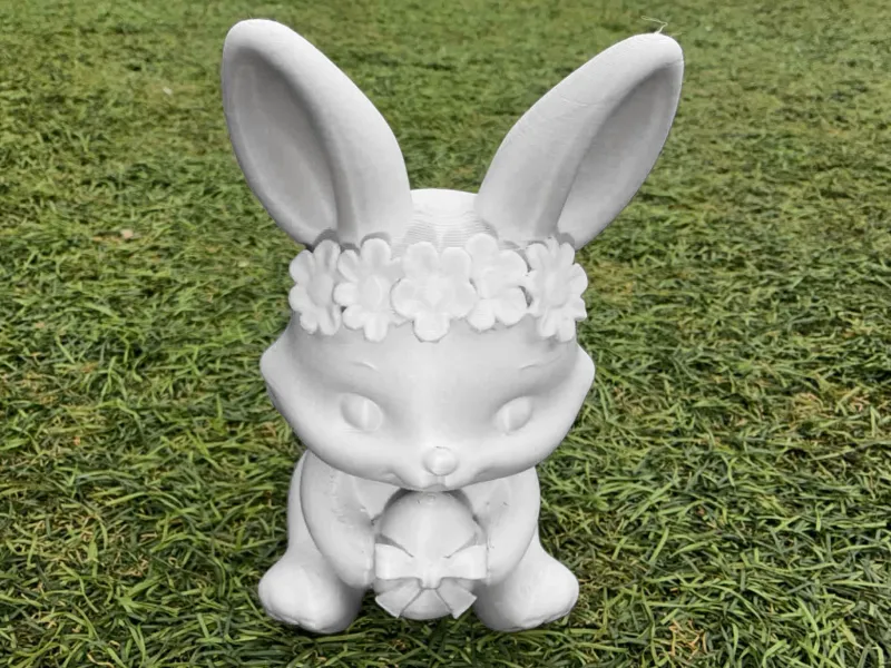 Flower-Crown Bunny Holding Bow-Tied Egg Spring Figurine