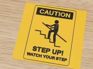 Caution sign: step up, watch your step