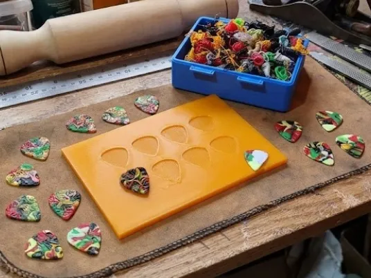 Template for making guitar picks using leftover filament