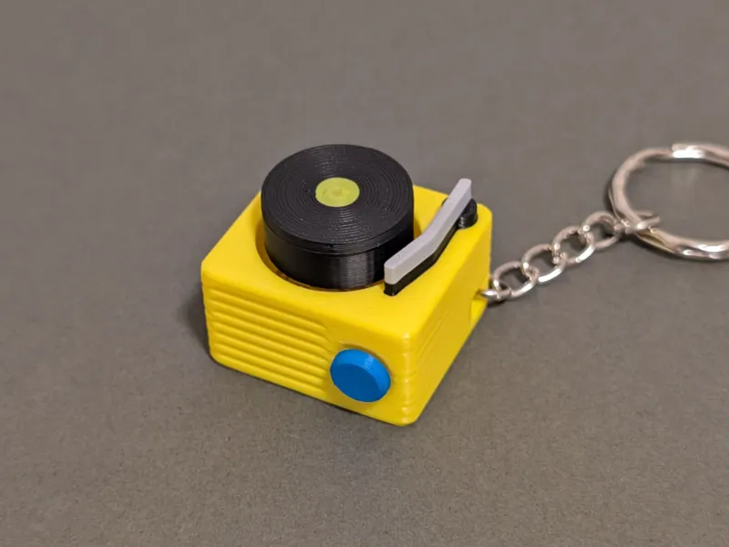 Tocadiscos Clicker Fidget y Llavero