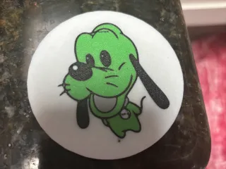 Pluto badge
