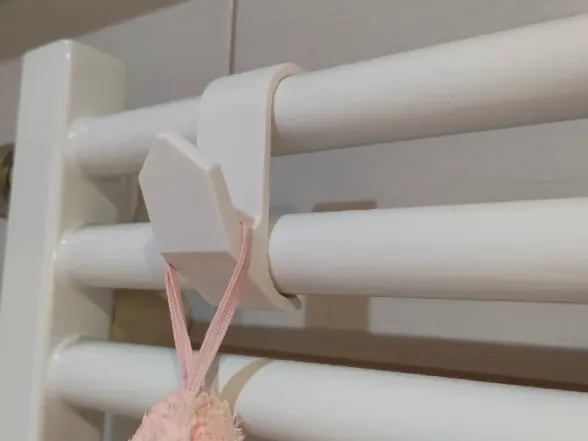 Radiator towel hook