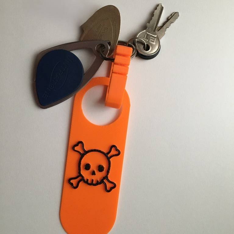 Skull and cross bone key ring.