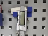 Caliper holder for perforated plate-0