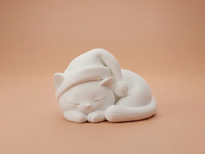 Schlafende Weihnachtskatze mit Weihnachtsmannmütze – Figurine