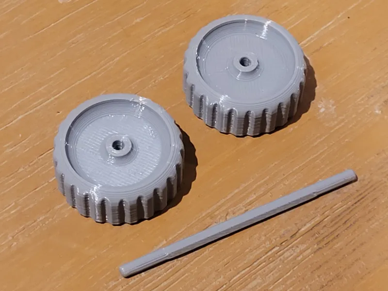 Pereche de roți mici cu ax de 3 mm