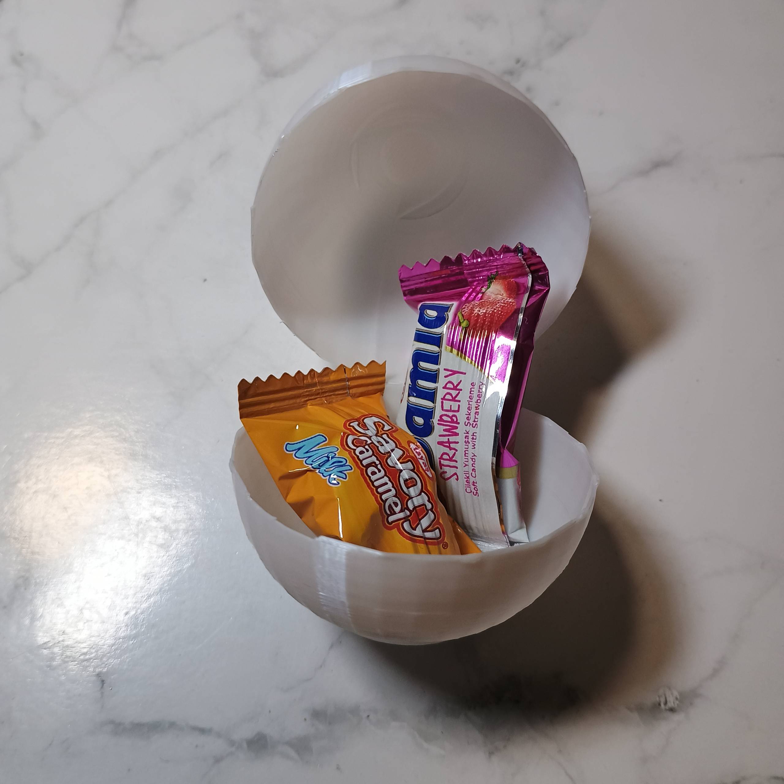 Easter egg, opens when pressed.